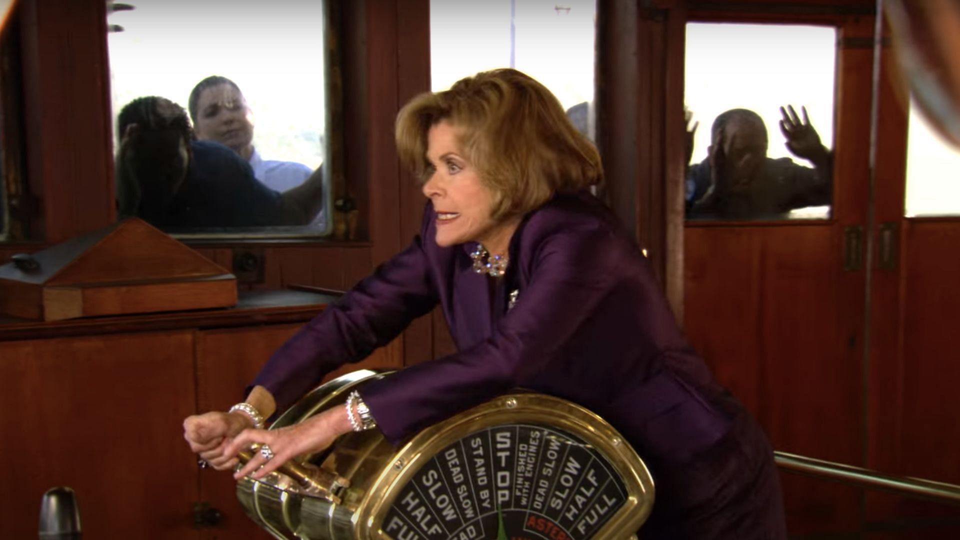 Lucille Bluth steering the RMS Queen Mary (Image via YouTube/Netflix)